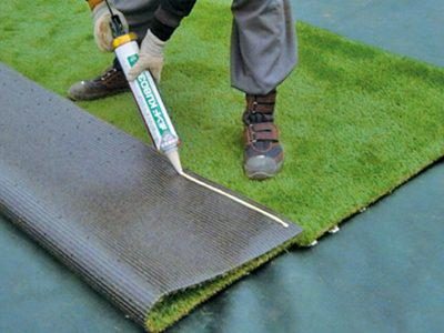 After temporarily placing all Really Turf®, carefully lift the turf by keeping it in place and apply the special glue to the back.